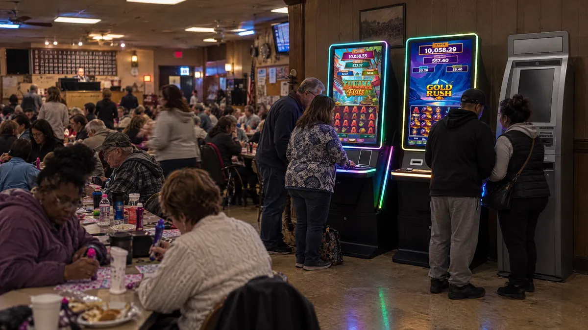 Two Foxfire cabinets and a payout kiosk at the edge of a bingo hall full of players