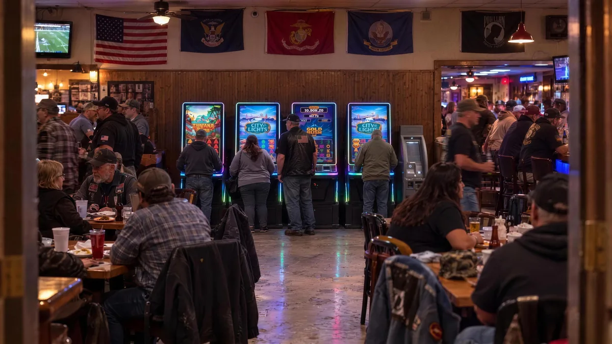 Four Foxfire cabinets under military flags in a busy veterans club
